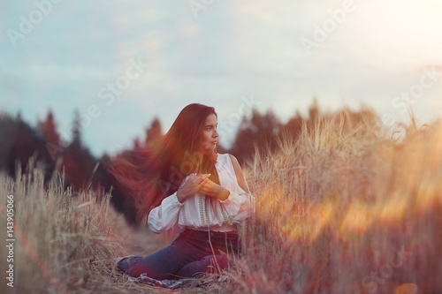 Summer portrait of a young adult beautiful girl