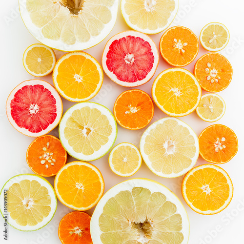Fresh lemon, orange, mandarin, grapefruit and sweetie on white background. Flat lay, top view.