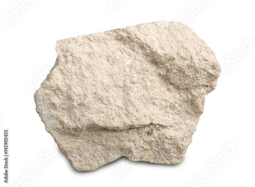 Limestone isolated on white background. Limestone is a sedimentary rock  composed of skeletal fragments of marine organisms.