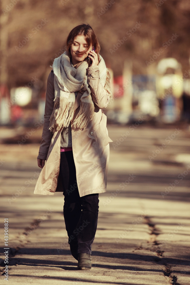 Fototapeta premium Autumn portrait of a girl in a coat