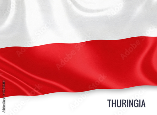 Flag of German state Thuringia waving on an isolated white background.