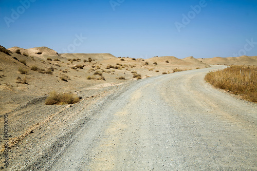 Off road in the wilderness desert with clear blue sky   Scenery in Tibet .