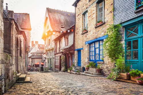 Fototapeta Naklejka Na Ścianę i Meble -  Charming street scene in an old town in Europe at sunset