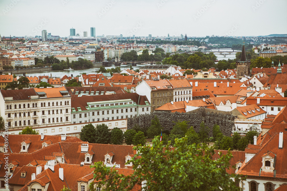 Houses with traditional red roofs in Prague Old Town Square