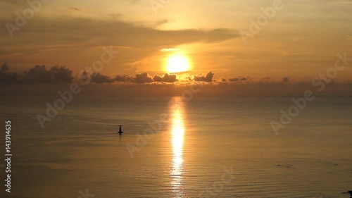 silhouette dawn at calm sea with light house, Hua Hin, Thailand 