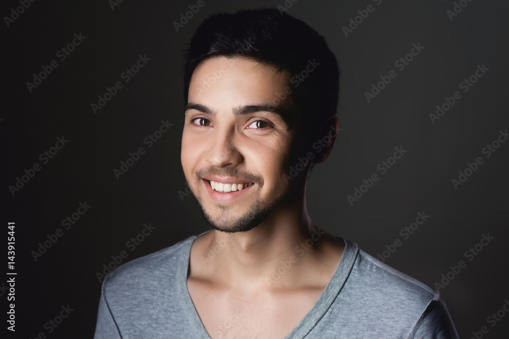 Obraz premium Portrait of a normal boy over grey background . Attractive young man