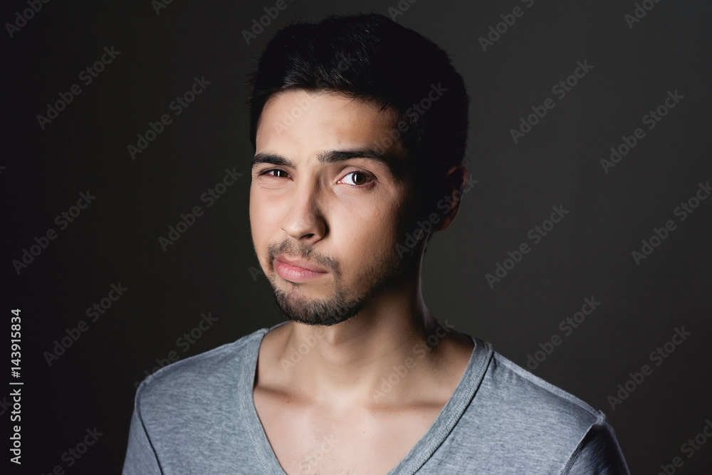 Fototapeta premium Portrait of a normal boy fun over grey background