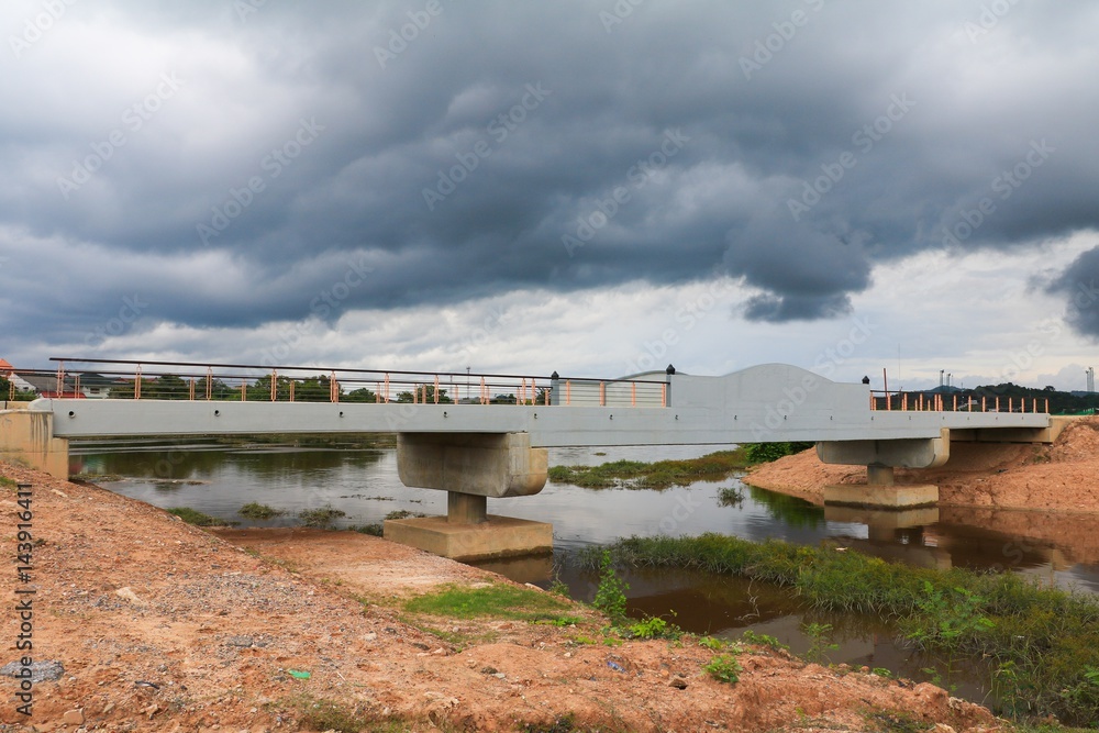 bridge road countryside and rain clouds beautiful over a canal bridge road countryside and rain clouds beautiful over a canal