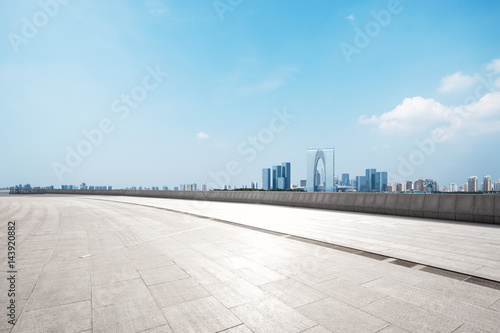 empty floor with modern cityscape and skyline