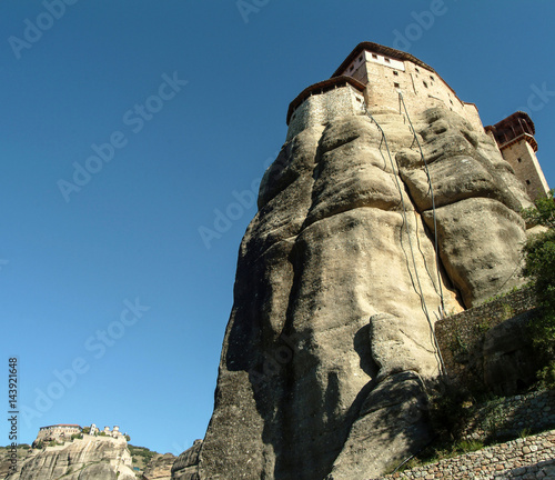 Low angle view of Roussanou Monastery on top of rock formation, Meteora, Thassaly, Greece photo