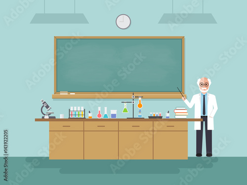 Senior science teacher teaching student in classroom.