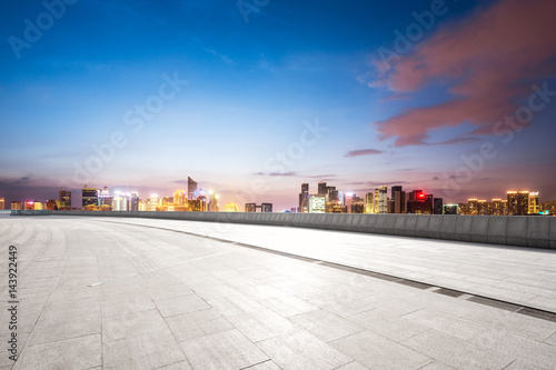 empty floor with modern cityscape and skyline