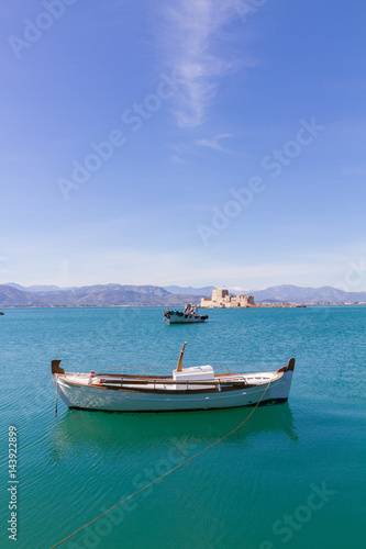 Fishing Boats and Bourtzi Fortress in Nafplion, Greece- portrait photo