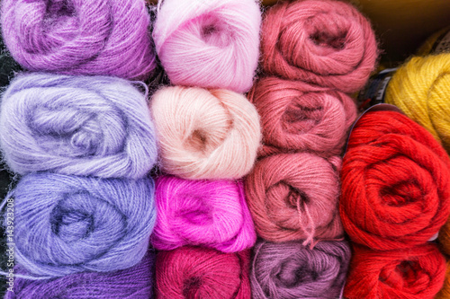 Photos Closeup of colored mohair yarn for knitting, skeins in purple, pink,  blue, red, yellow,ect