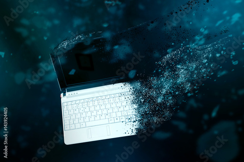 Schilderij op canvas The old laptop is disintegrating in space