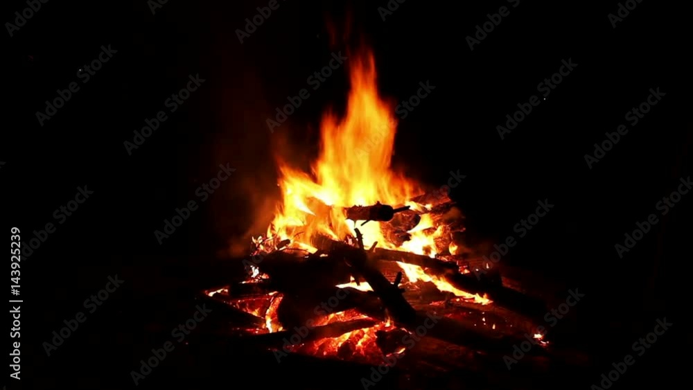 Bonfire burning trees at night. Bonfire burning brightly, heat, light,camping, big bonfire. Bonfire burning trees at night. Bonfire burning brightly, heat, light,camping, big bonfire.