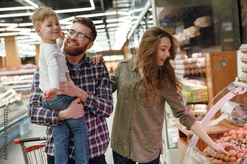 Young family near the counter with eggs