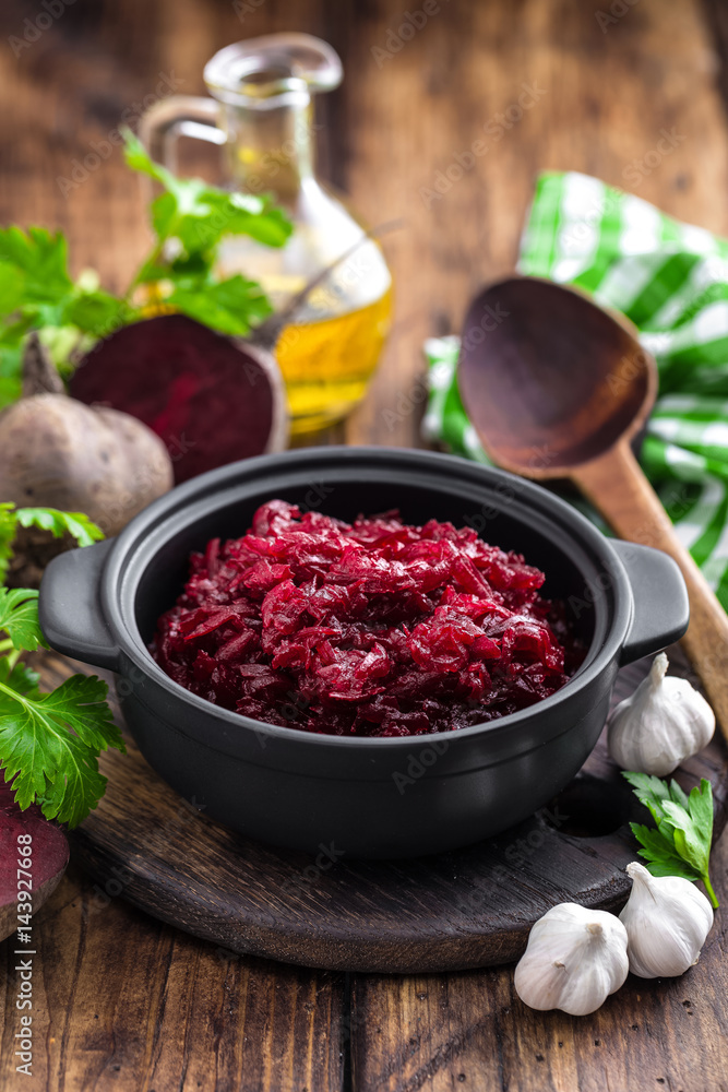 Beetroot salad on wooden background closeup Beetroot salad on wooden background closeup