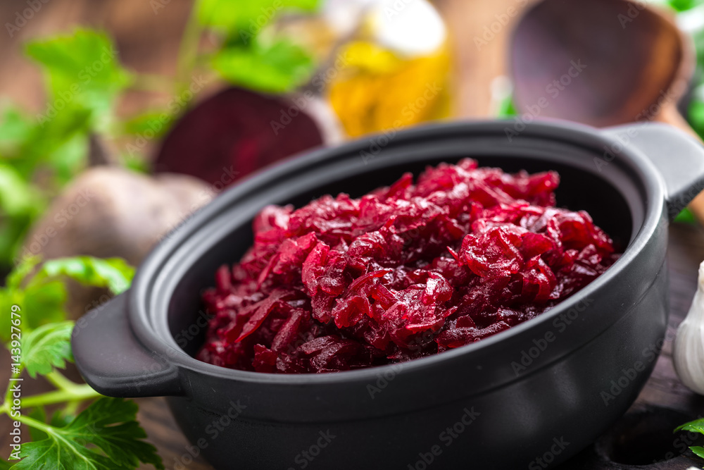 Beetroot salad on wooden background closeup Beetroot salad on wooden background closeup