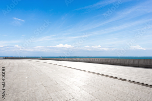 empty floor with blue cloud sky © zhu difeng