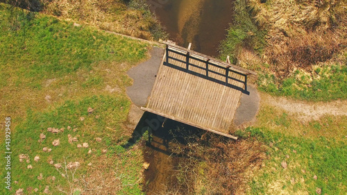 Top view of a wooden bridge at the Eutersee. The Eutersee is a little lake in south Hessia, Germany.
