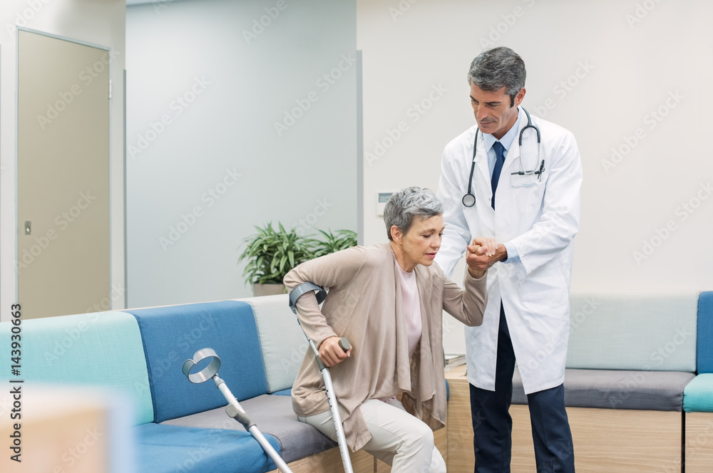 Doctor helping patient Doctor helping patient