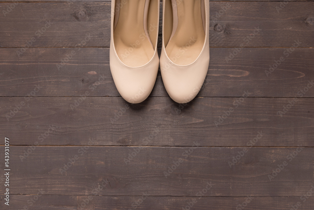 High heels are on wooden background with copy space