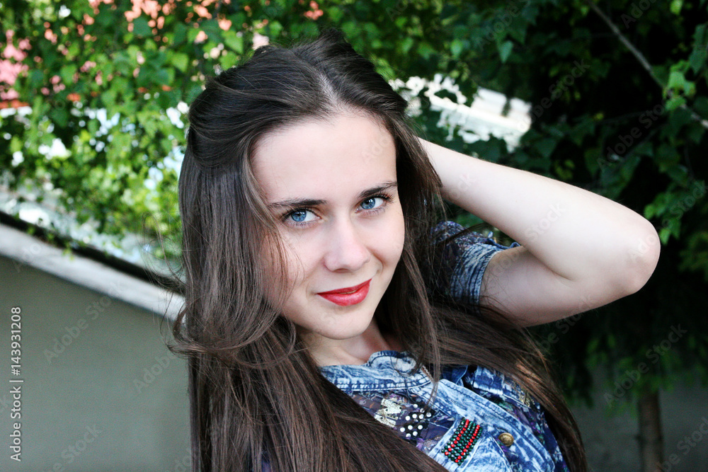 Smiling brunette on the nature of the spring Smiling brunette on the nature of the spring