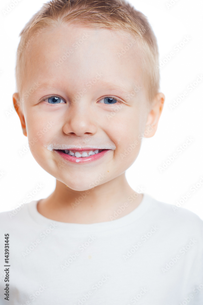 Smiling little boy with milk on his lips Smiling little boy with milk on his lips