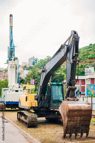 Excavator at a construction site. Building a house in Montenegro, Budva.