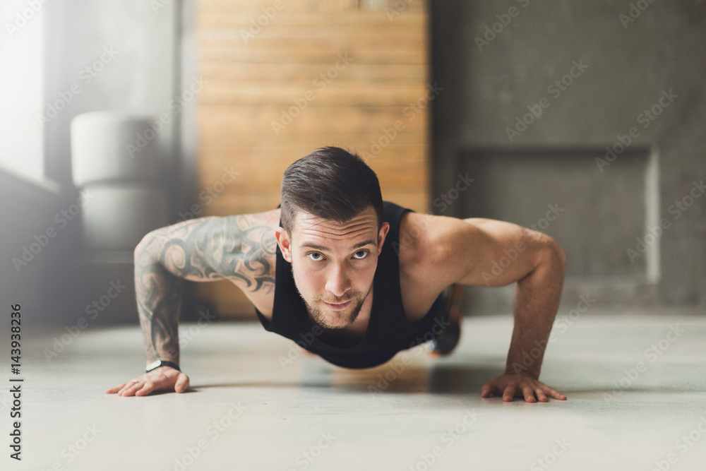 Young man fitness workout, push ups