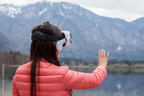 young woman in VR glasses © chechotkin
