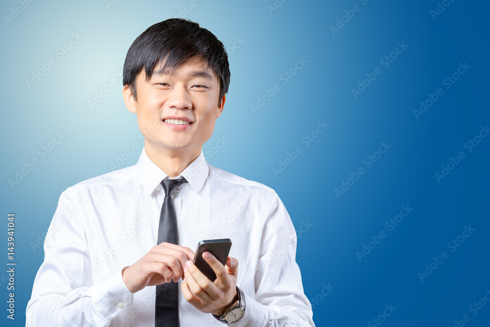 Asian businessman talking on mobile cell phone Asian businessman talking on mobile cell phone