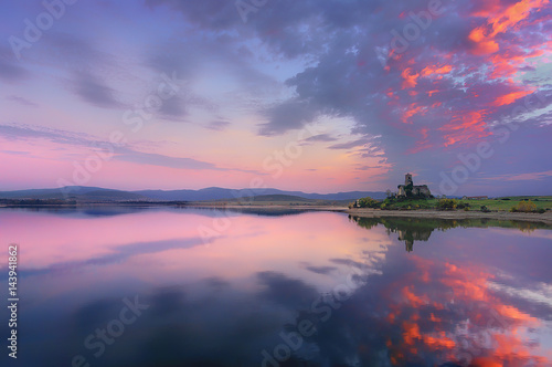 ruins of Azua church with reservoir reflections photo