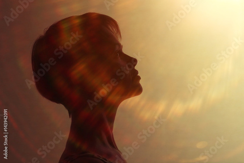 Silhouette of a girl with short hair studio portrait