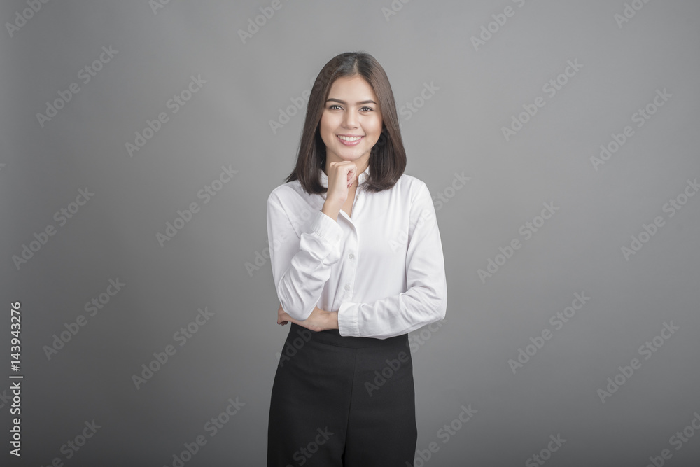 Beautiful Business Woman smiling on grey background Beautiful Business Woman smiling on grey background