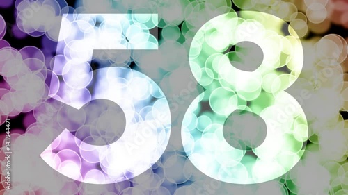 Fifty eight to fifty nine years birthday fade in/out animation with color gradient moving bokeh background. Animation: 90 frames still with number, 180 fade out, 30 clear, 180 fade in, 300 still.
 photo