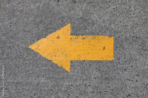Yellow asphalt sign, arrow