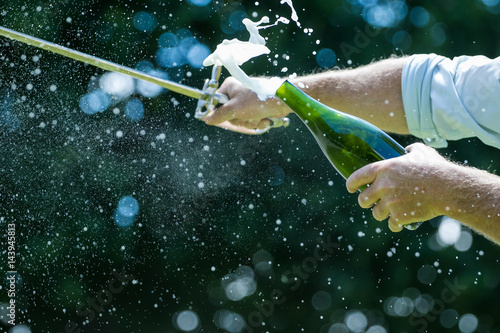 Konstfotografi Close up image of a bottle of champagne being opened with a sword, also called s