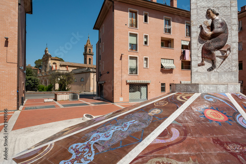 Public monument with Santa Verdiana church in the background, Castelfiorentino, Italy photo