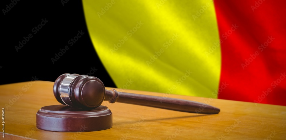 Composite image of close up of gavel on table
