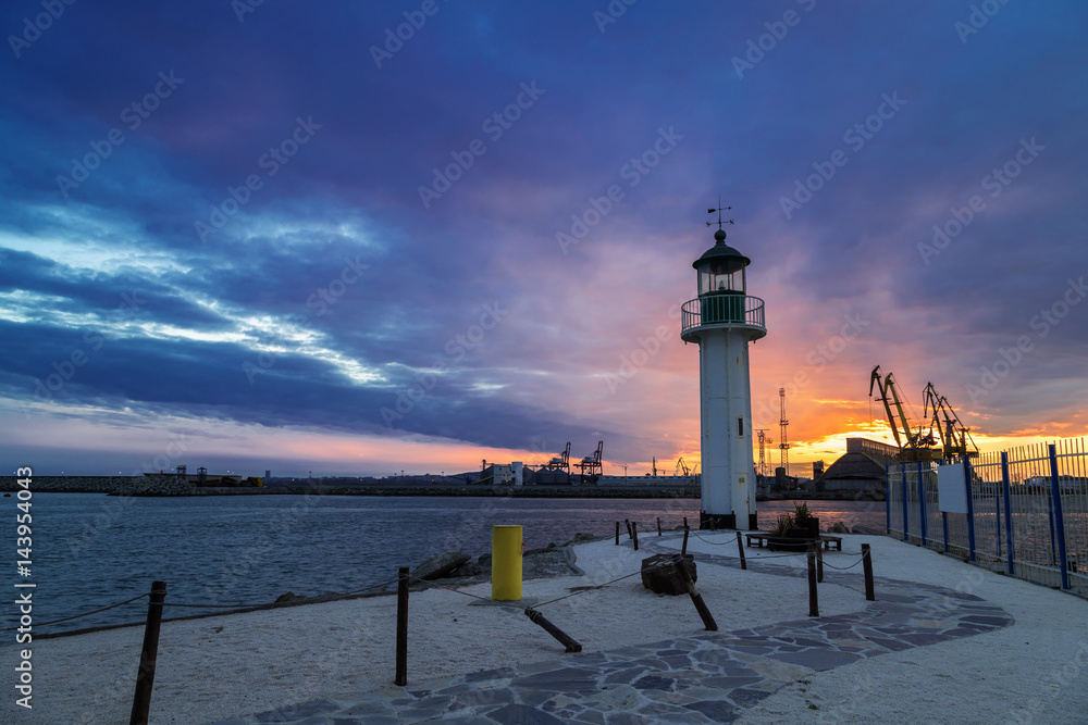 Sunset over the lighthouse at the port of Burgas