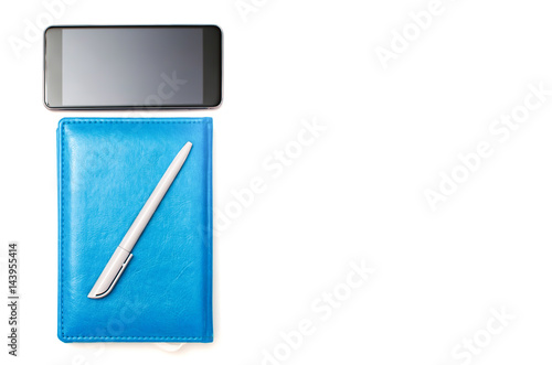 .The pen on the notepad next to the phone. Business concept and idea for development photo