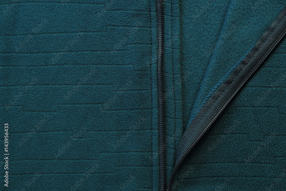 Green textile jacket with zipper close-up