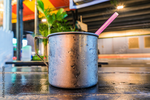 Cup on a table at night