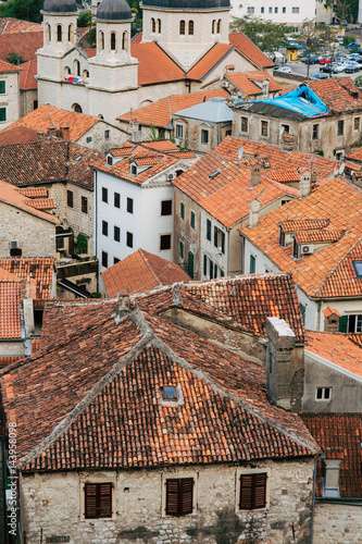The Old Town of Kotor. The orange-tiled rooftops of the city. Shooting from the observation platform on the wall of the city. Montenegro