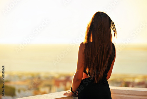 Brunette girl at sunset photo