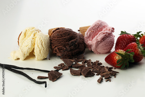 three scoops of ice cream - vanilla  strawberry and chocolate
