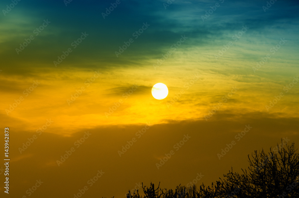 Sunset in the evening on a background of blue sky Sunset in the evening on a background of blue sky
