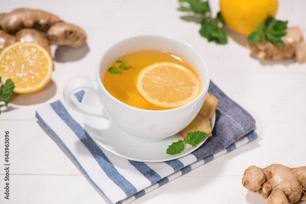 Healthy ginger tea ingredients on a wooden table Healthy ginger tea ingredients on a wooden table